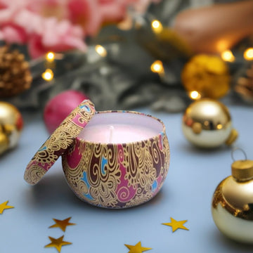 A pink candle on a blue table