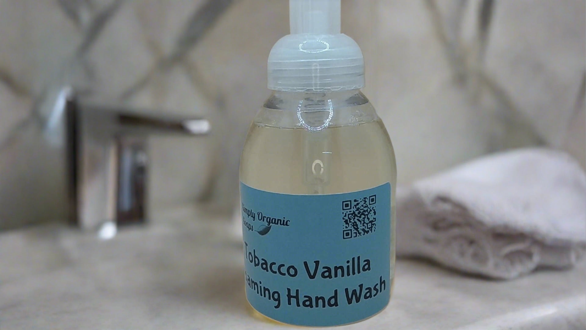 a bottle of sanitizing hand soap sitting on a sink