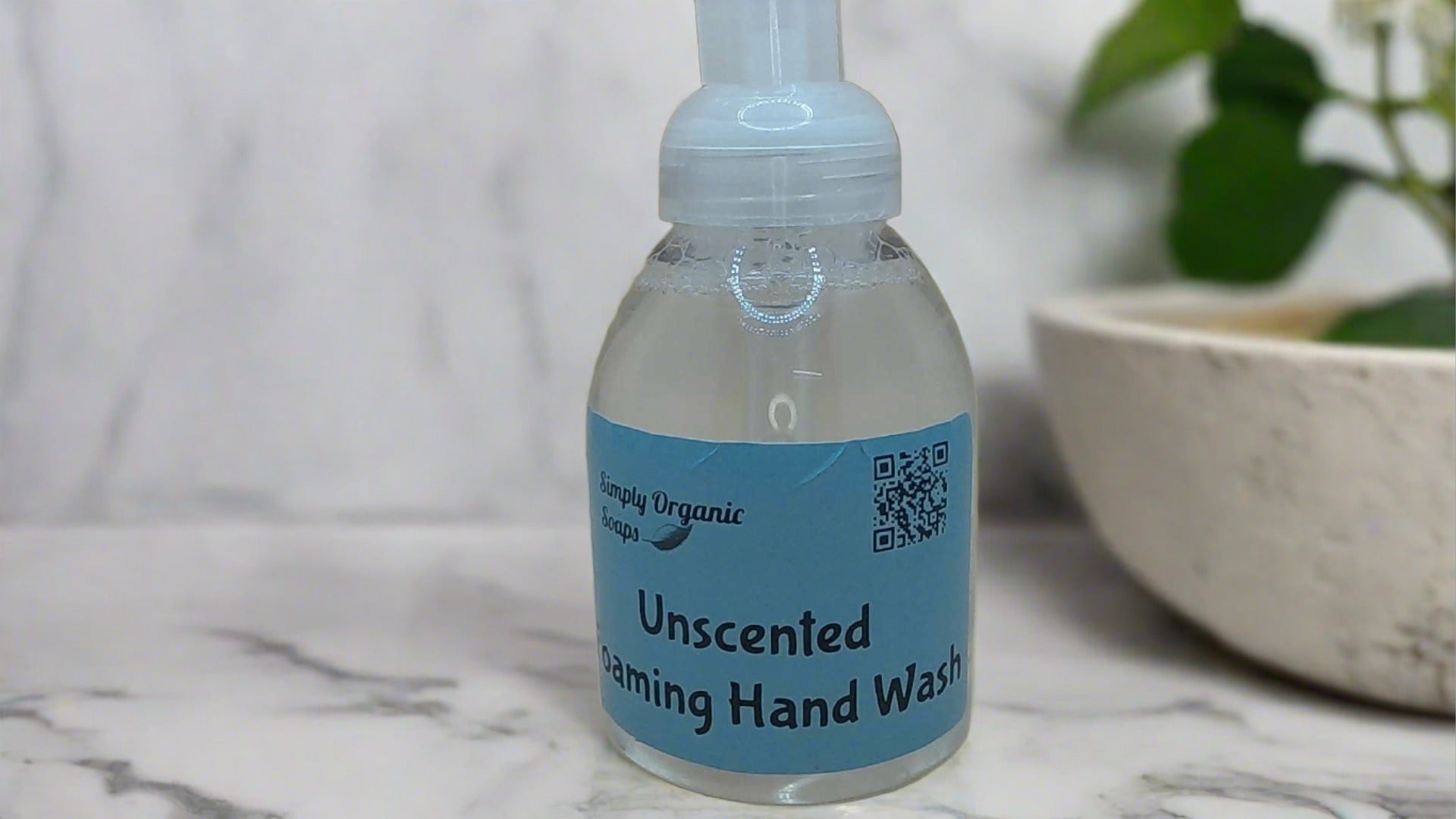 a bottle of hand wash sitting on a counter