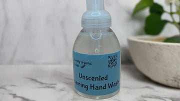 a bottle of hand wash sitting on a counter