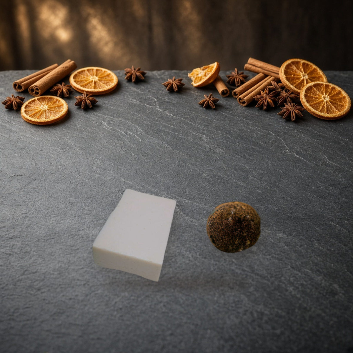 Cinnamon Nutmeg Goat Milk Soap handmade soap on slate with holiday spices and dried oranges