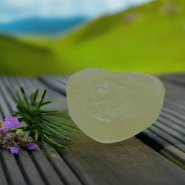 a piece of soap sitting on top of a wooden table