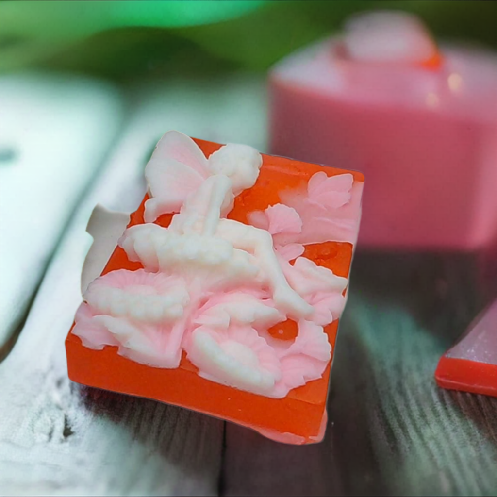 a couple of soaps sitting on top of a wooden table