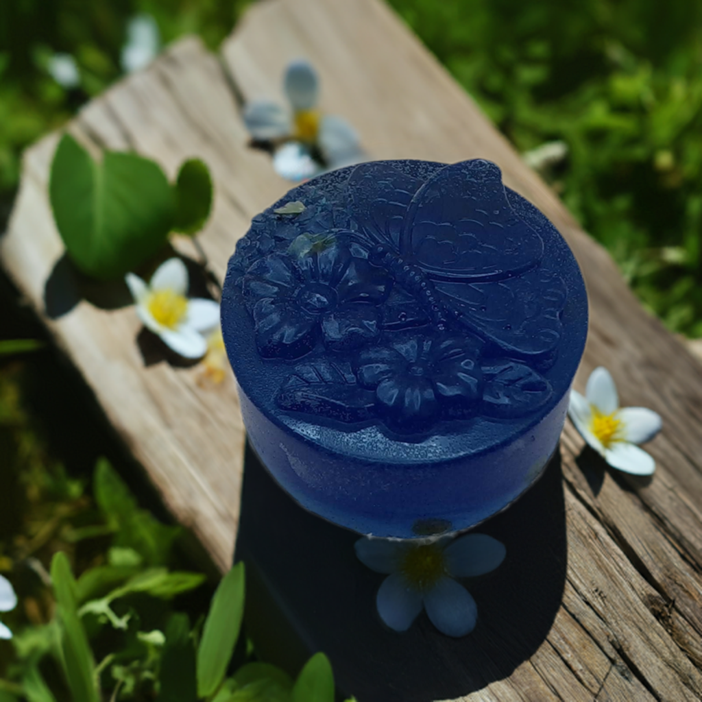 a blue soap sitting on top of a wooden table