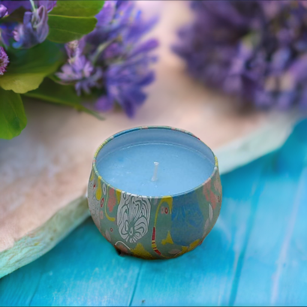 a blue candle sitting on top of a blue table