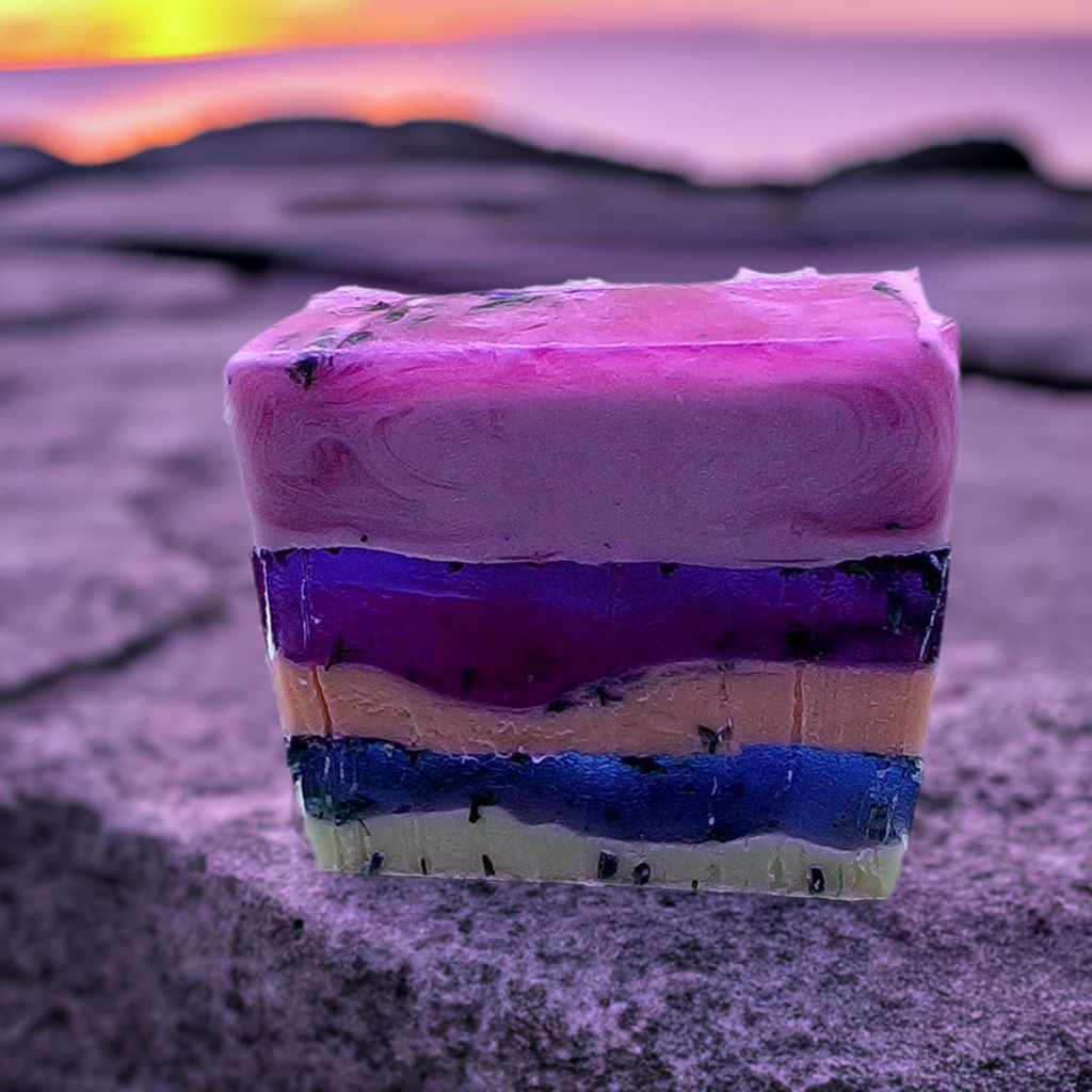 a piece of soap sitting on top of a sandy beach