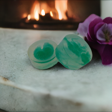 a couple of soaps sitting on top of a table