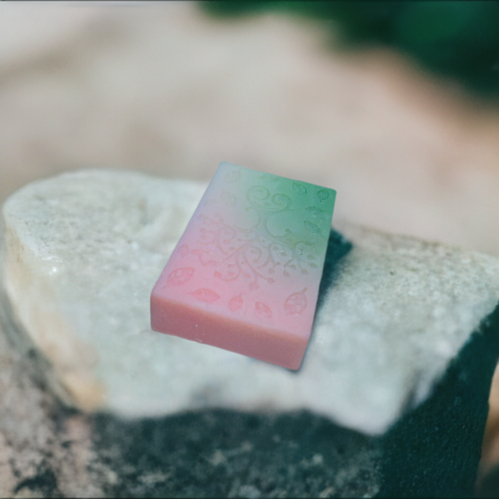 a piece of soap sitting on top of a rock