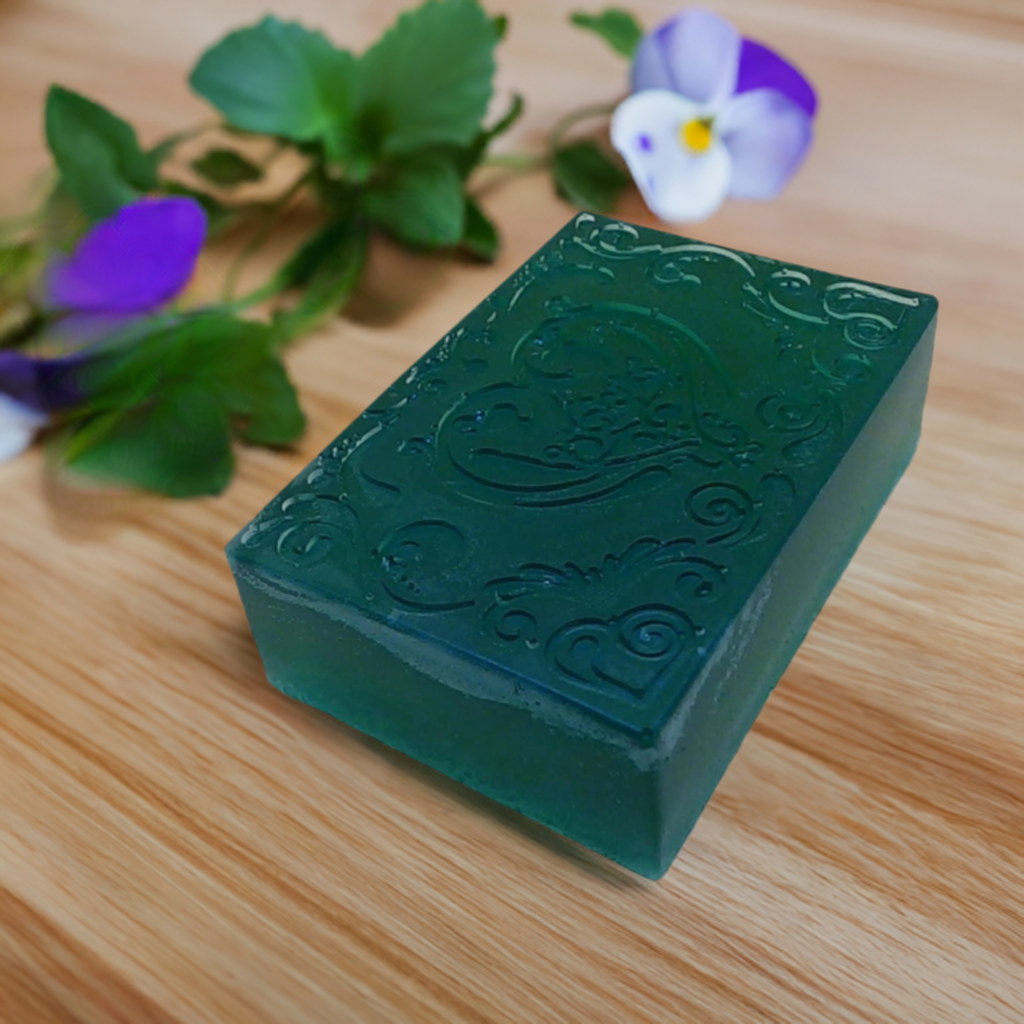 a green soap sitting on top of a wooden table