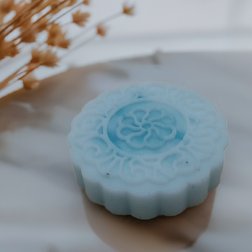 a blue soap sitting on top of a table