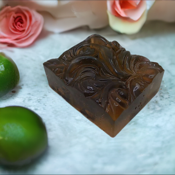 Organic Soap sitting next to some limes