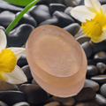 a soap bar sitting on top of a pile of rocks