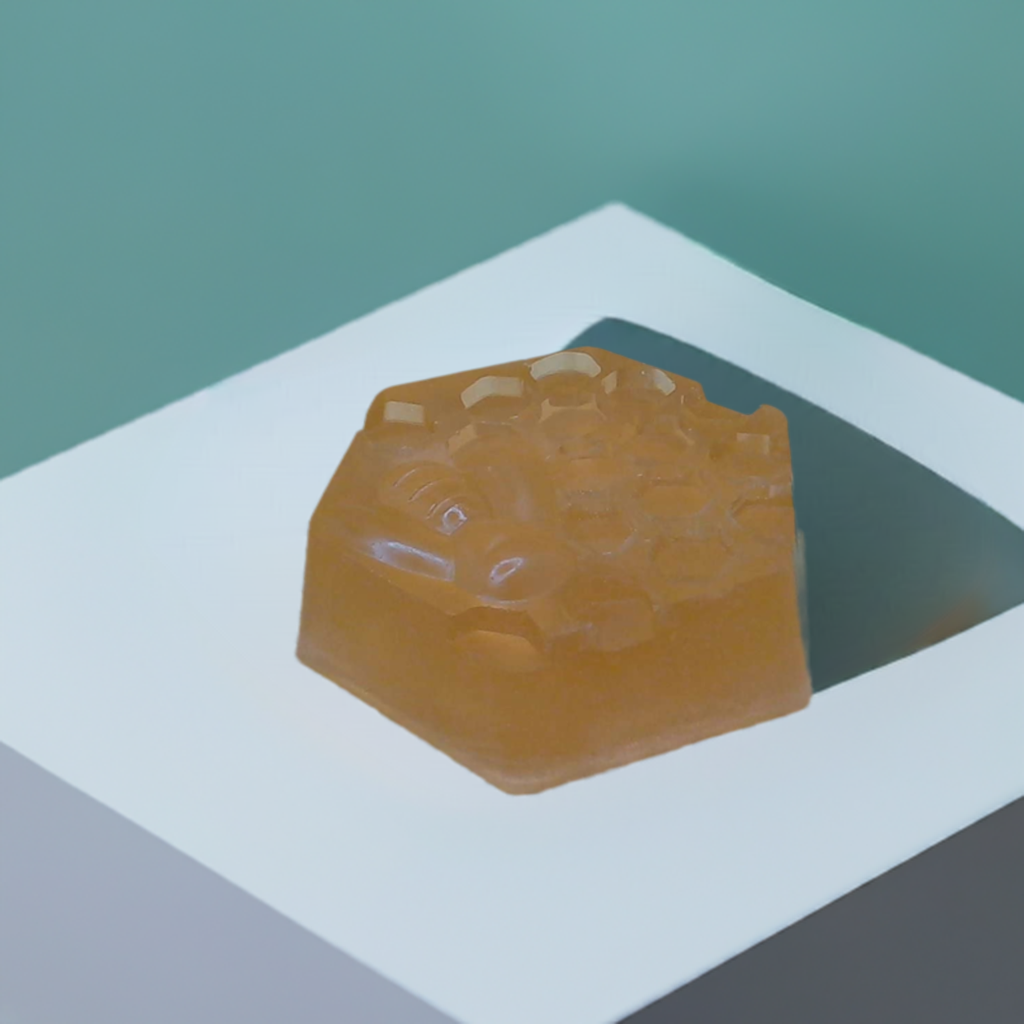 a piece of soap sitting on top of a white table