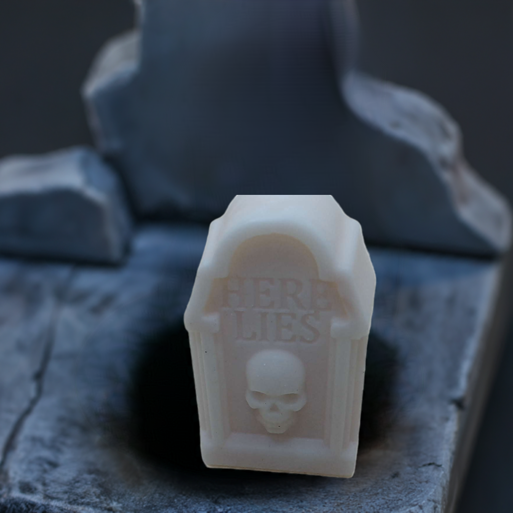 a white wax stamp with a skull on it