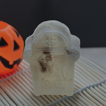 a carved ghost soap next to a carved pumpkin