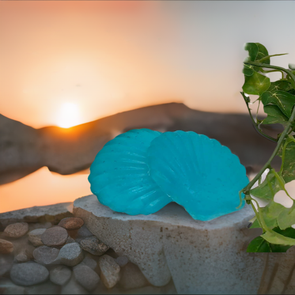 a blue object sitting on top of a rock next to a plant