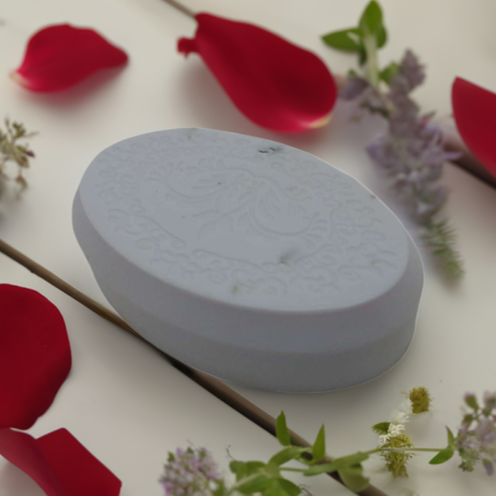 a white box sitting on top of a table surrounded by flowers