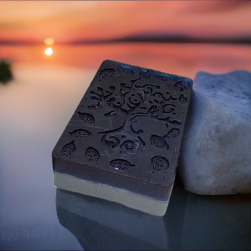 a soap bar sitting on top of a rock