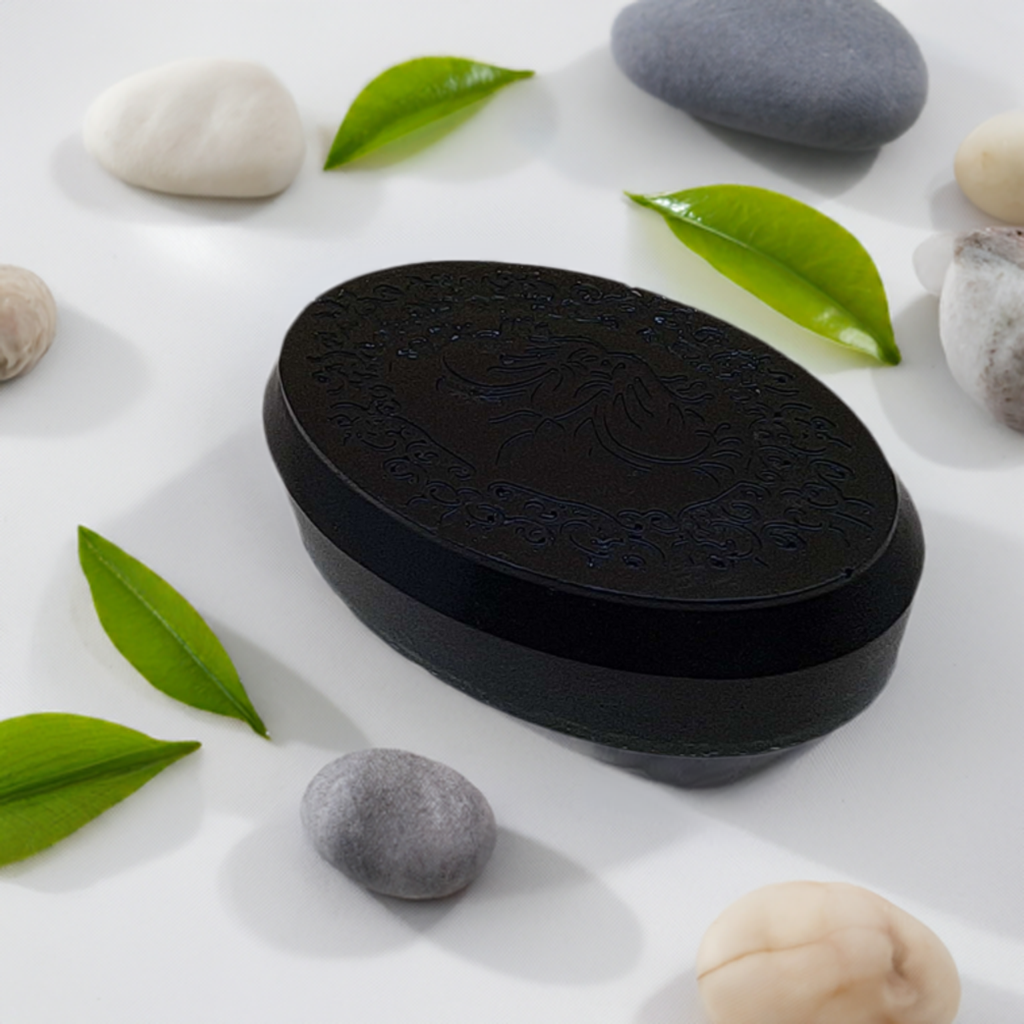 a black soap sitting on top of a white table