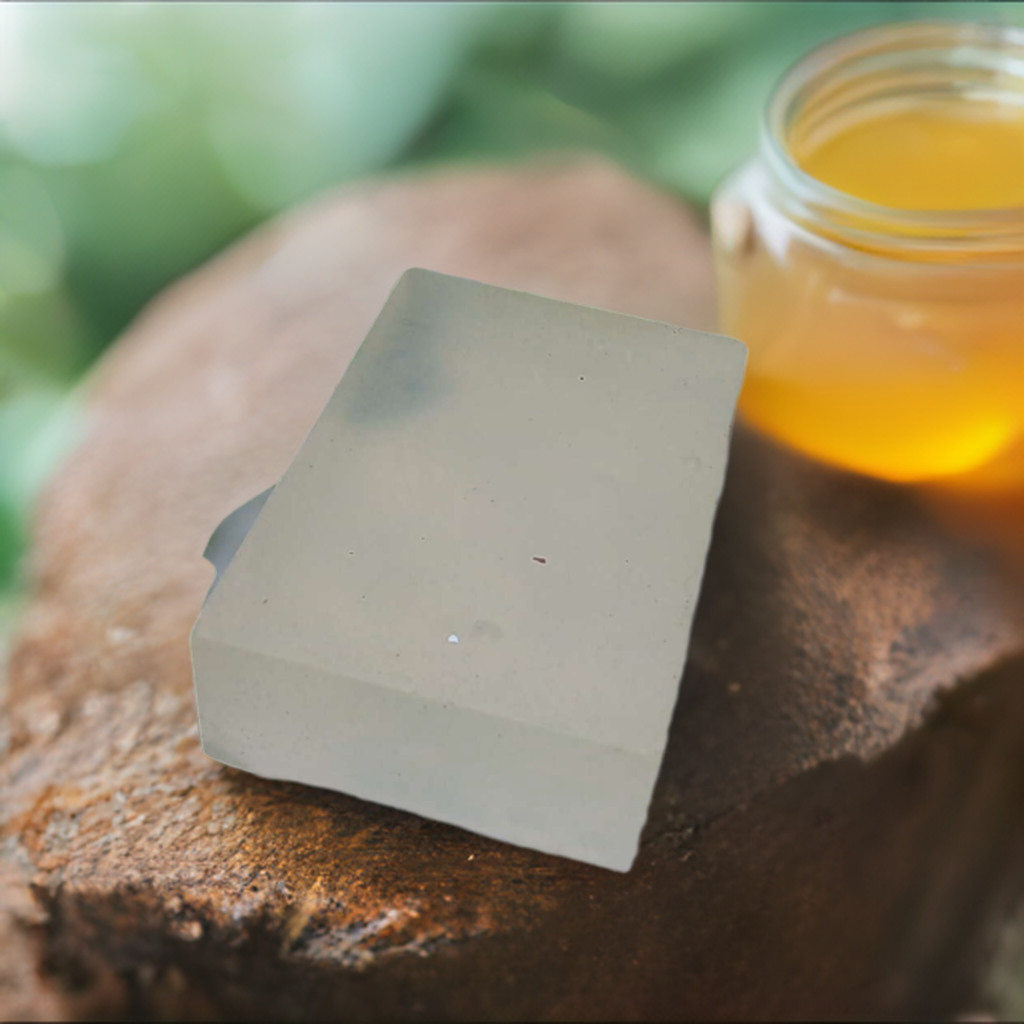 a jar of honey sitting on top of a tree stump