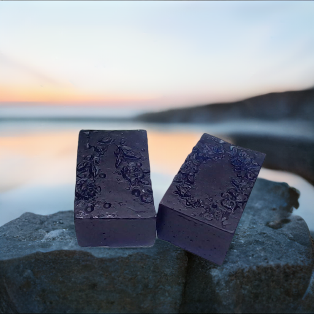 a couple of soaps sitting on top of a rock