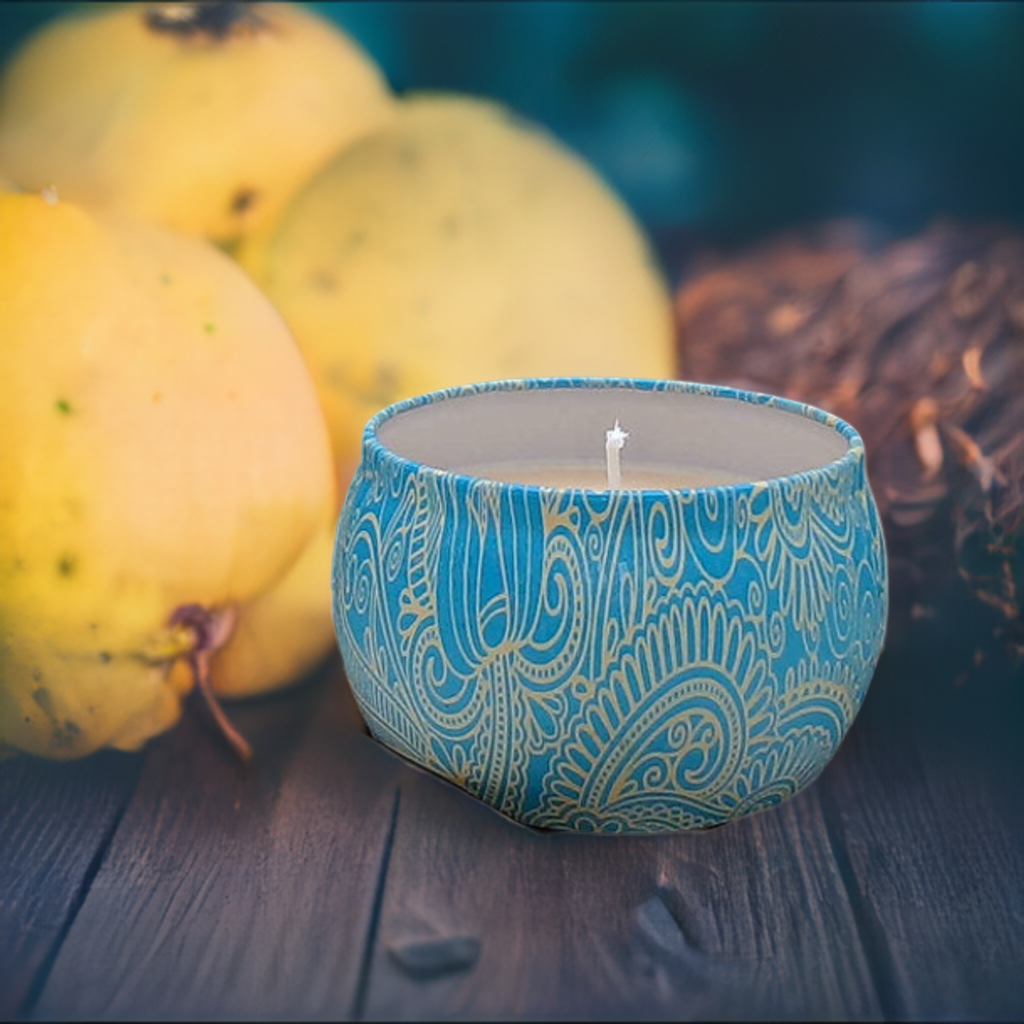 a blue candle sitting on top of a wooden table