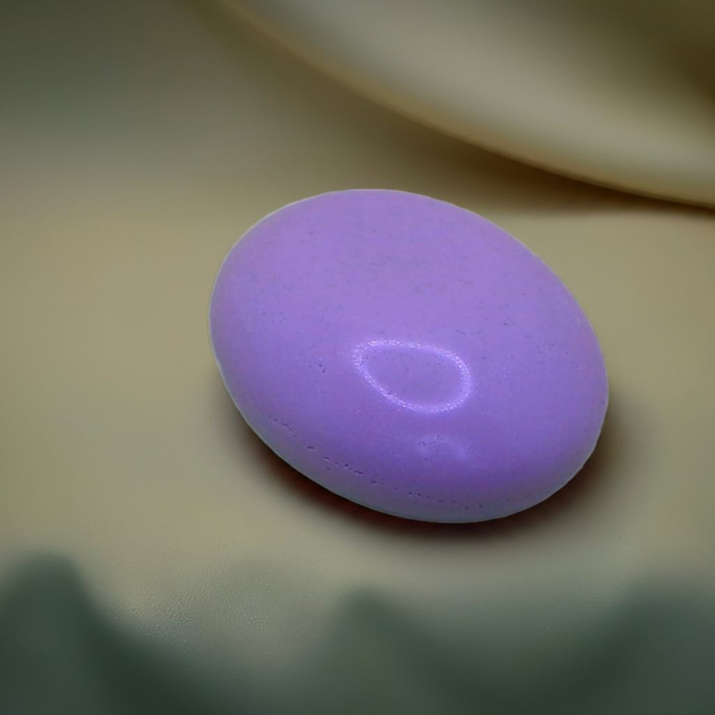 a purple soap sitting on top of a table