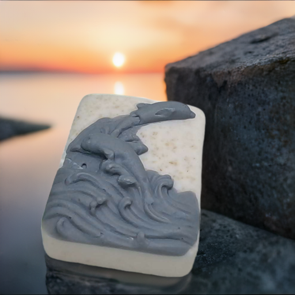 a soap bar sitting on top of a rock next to the ocean