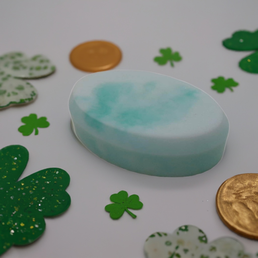 a soap bar sitting on top of a table next to a penny