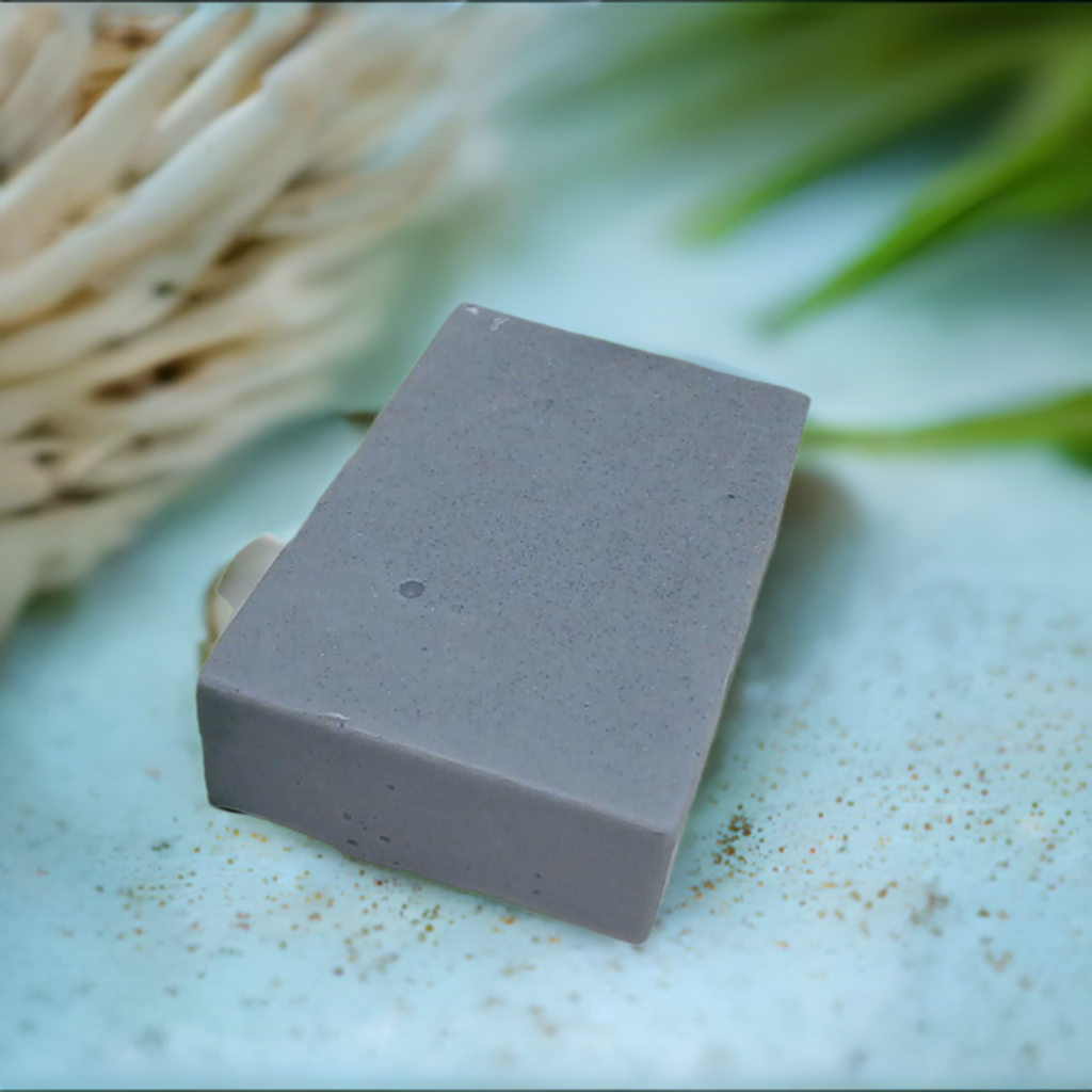 a soap bar sitting on top of a table next to a basket