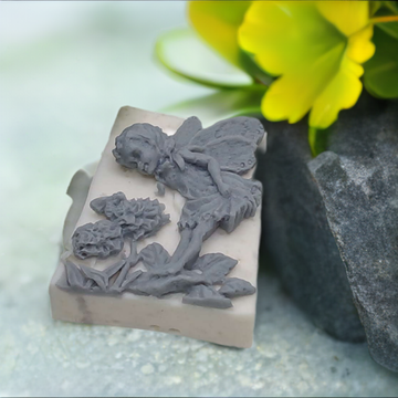 a close up of a fairy soap figurine on a table