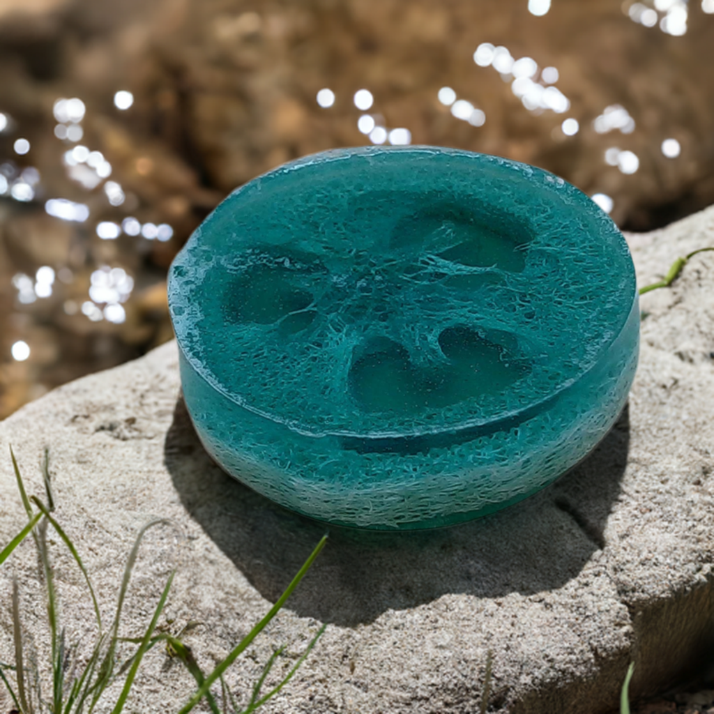 a blue bowl sitting on top of a rock