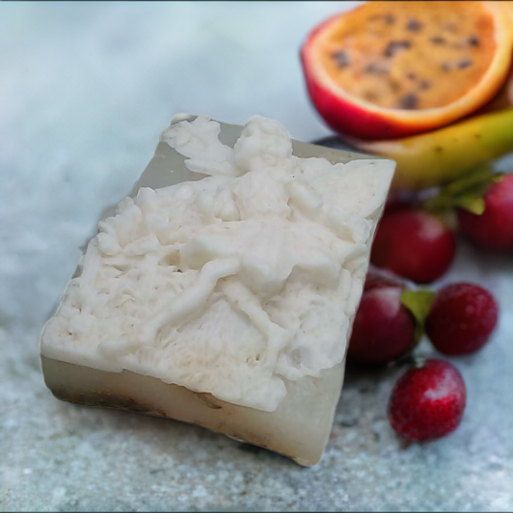 a soap bar sitting on top of a counter next to fruit