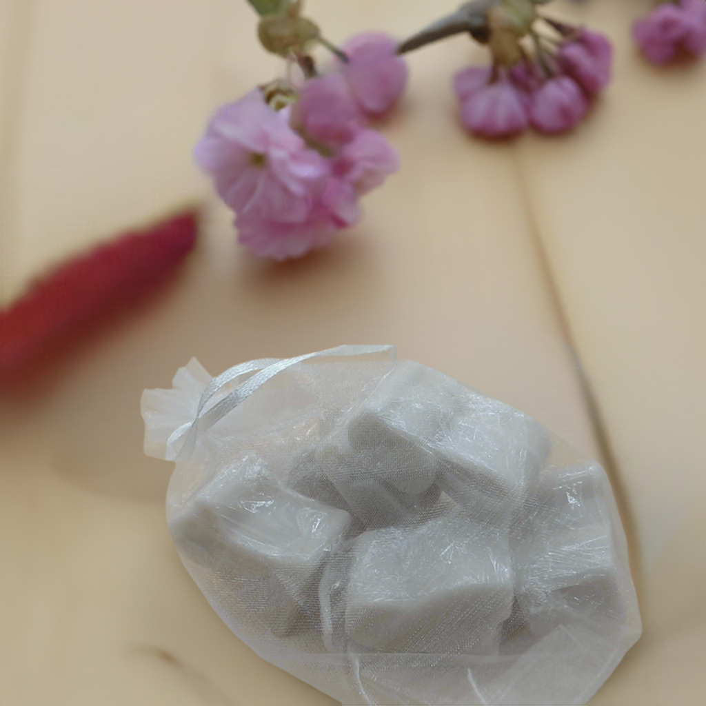 a plastic bag filled with food sitting on top of a table