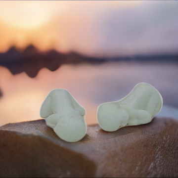 a couple of pieces of food sitting on top of a rock