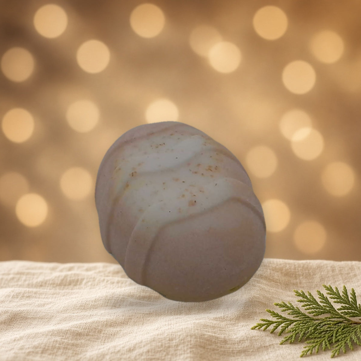 Sweet Orange & Strawberry Oatmeal Goat Milk Easter Egg Soap handmade soap on linen with warm holiday bokeh lights